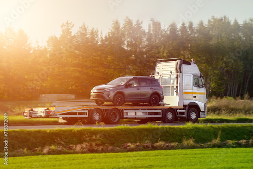 Foto Flatbed transporter on the highway.
