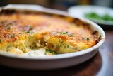 close-up on the crispy golden edge of gratin dauphinois