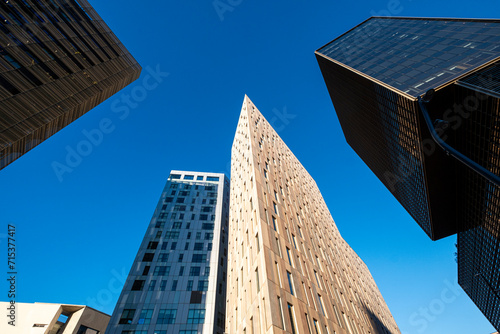 Low angle view of modern office buildings in the financial area of Poblenou in the city of Barcelona in Catalonia in Spain photo