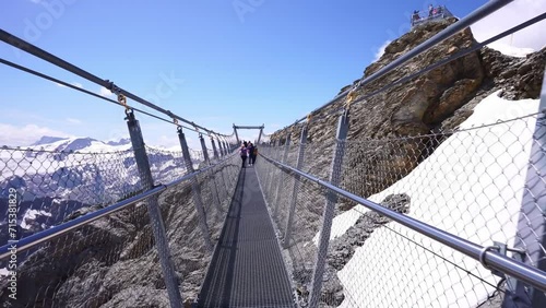 Titlis bridge walk. Mount Titlis glacier panorama of Uri Alps in Switzerland. Swiss Alps. popular tourism destination from Lucerne.