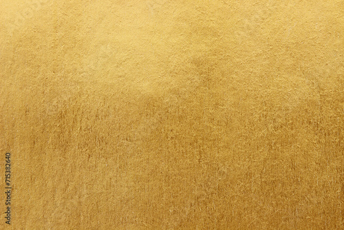Gold paper texture background. gold wall background