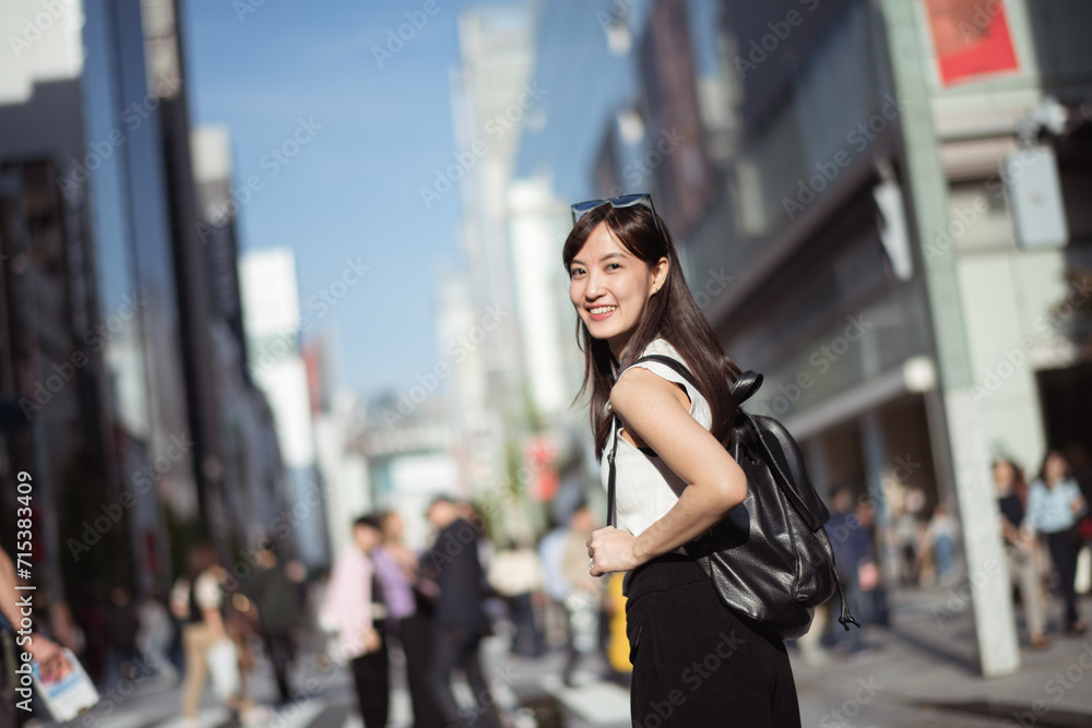 Fashionable career, Stylish Japanese woman showcasing the blend of career success and modern fashion in Tokyo.