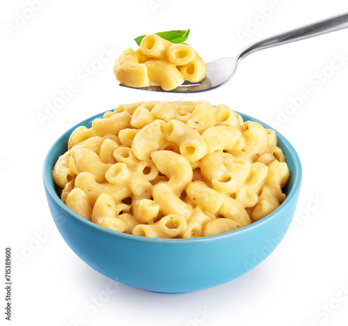 Mac and cheese. Creamy macaroni and cheese pasta isolated on white background. Fork with pasta and basil. With clipping path. photo