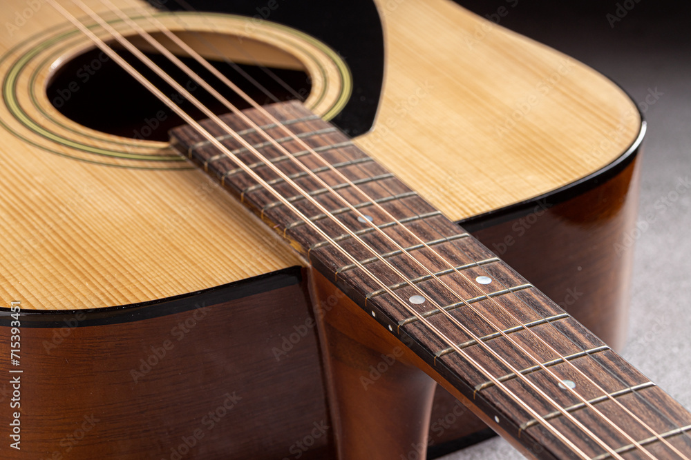 Classical guitar close up. Acoustic guitar on wood background.Music instrument concept Classical guitar close up. Acoustic guitar on wood background.Music instrument concept