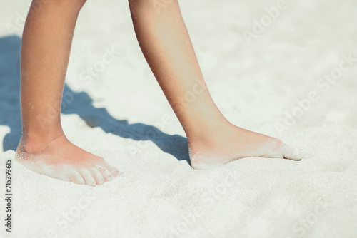 A Feet and footprints by the seashore in nature travel vacation background