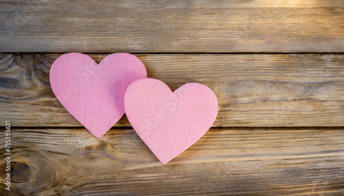 pink heart on wooden background