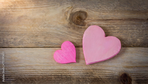 pink heart on wooden background