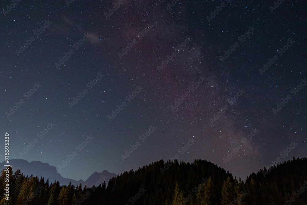 starry sky in summer mountains and milky way Trentino Alps