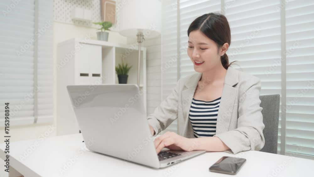 Asian business woman working with computer laptop in office room. Professional Asia female typing and sending email in office. Business person and workplace concept Asian business woman working with computer laptop in office room. Professional Asia female typing and sending email in office. Business person and workplace concept