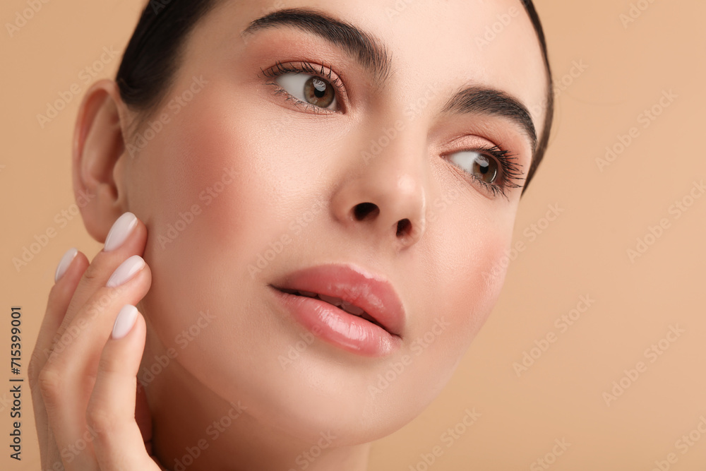 Beautiful woman with healthy skin on beige background, closeup Beautiful woman with healthy skin on beige background, closeup
