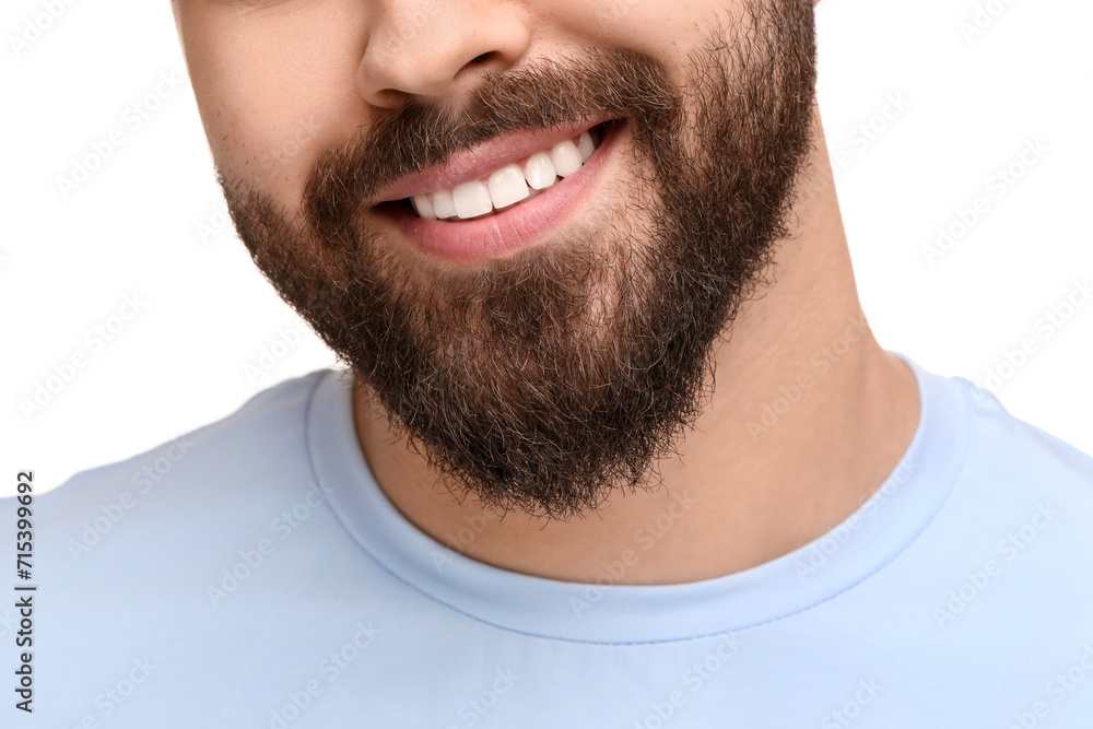 Fototapeta premium Man with clean teeth smiling on white background, closeup