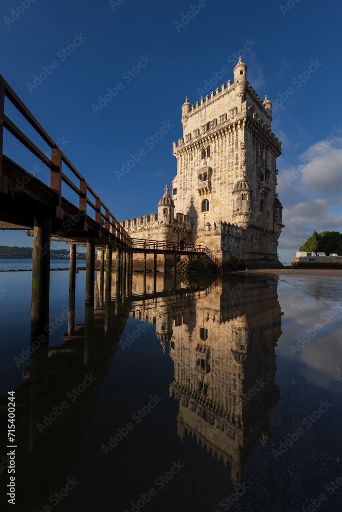 Belem Tower With Mirror Reflection In Water In Lisbon, Portugal