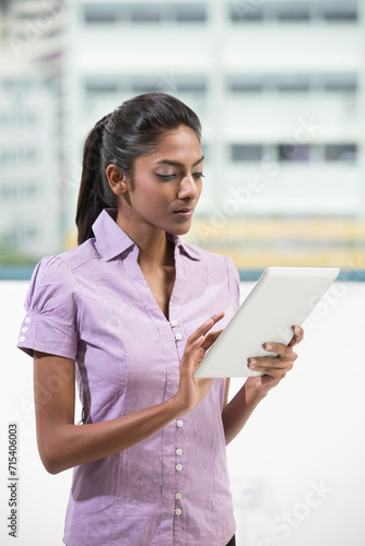 Indian office executive using a digital tablet