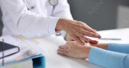 Doctor stroking hand and pitying patient in clinic clinic 4k movie slow motion. Psychological support for incurable patients concept