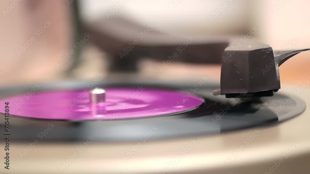 Close up of a Vinyl Record; Macro shot of old vinyl recording rotating in vintage player Close up of a Vinyl Record; Macro shot of old vinyl recording rotating in vintage player