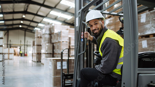 Portrait of warehouse worker driving forklift. Warehouse worker preparing products for shipmennt, delivery, checking stock in warehouse. Banner with copy space. © Halfpoint