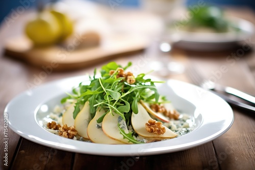 arugula salad with pear slices and gorgonzola crumble
