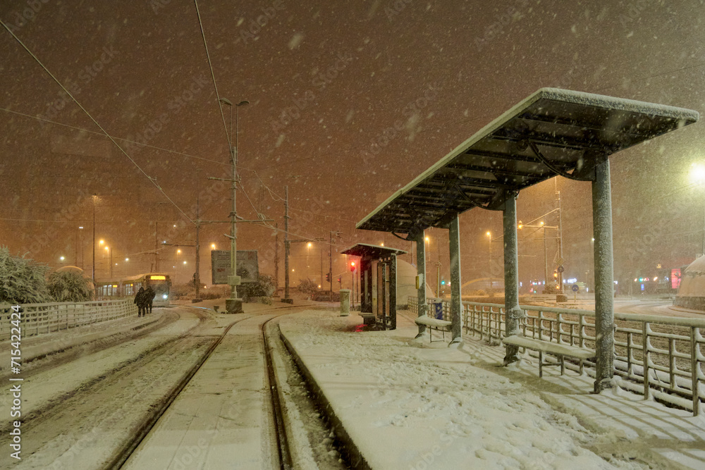 People in traffic through snow in Bucharest, Romania,