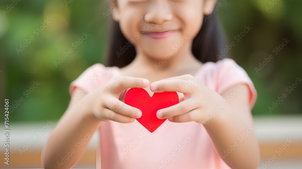 kid holding the shape of the heart.close up image
kid holding the shape of the heart.close up image