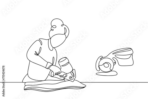 Seamstress. Cutting fabric. Rotary catter