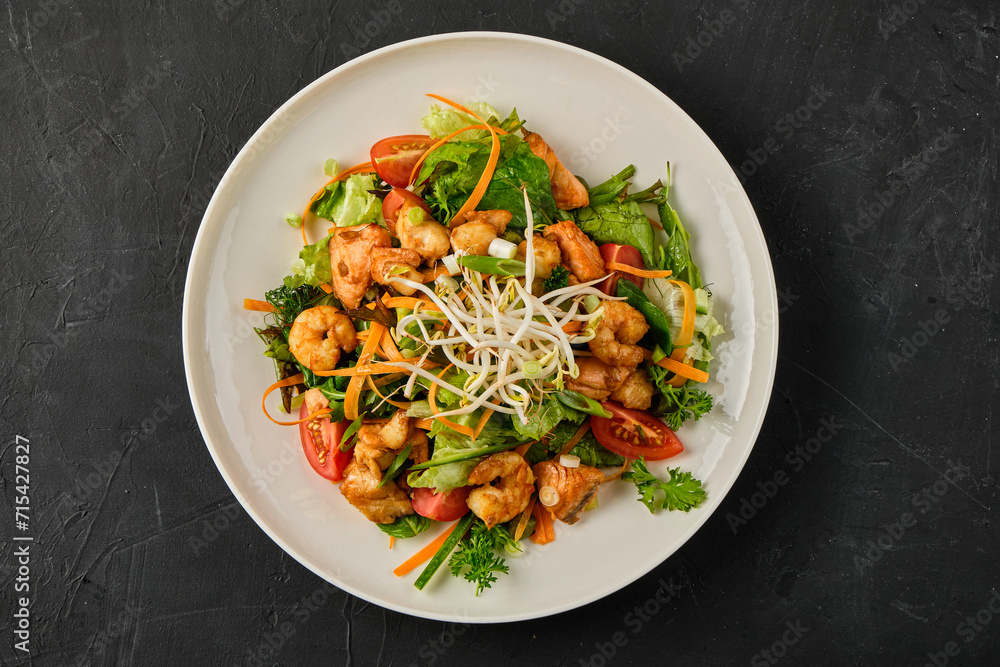 Close up photo of Seafood salad with shrimp, salmon, and fresh vegetables Close up photo of Seafood salad with shrimp, salmon, and fresh vegetables