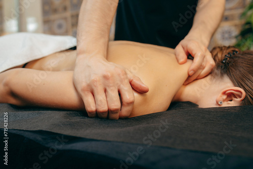 Male hands doing back massage