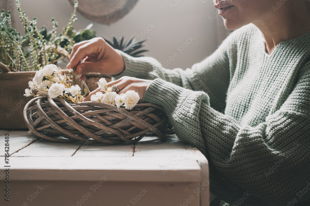 Close up view of woman enjoying time with gardening indoor leisure activity at home. Green color and mood mage of people working indoor. Relaxation and nature composition people. Alone lady lifestyle