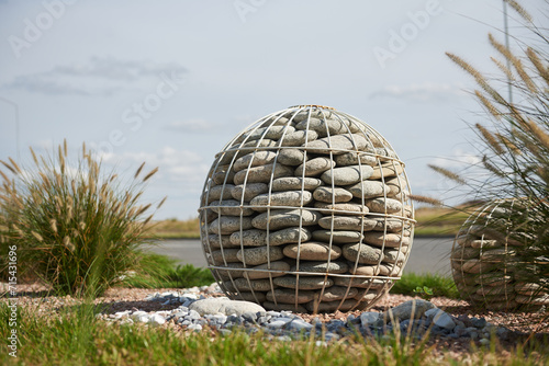 Decorations in the garden in the form of a pebble ball