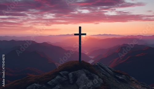 a cross is on top of a mountain at sunset.