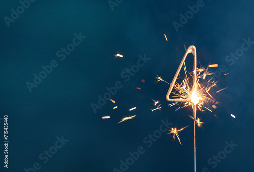 4 years celebration festive background made with Bengal fires in the form of number Four.