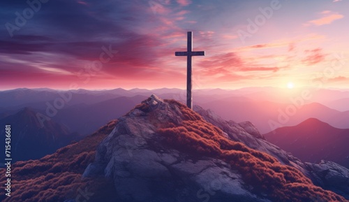 a cross is on top of a mountain at sunset. © olegganko