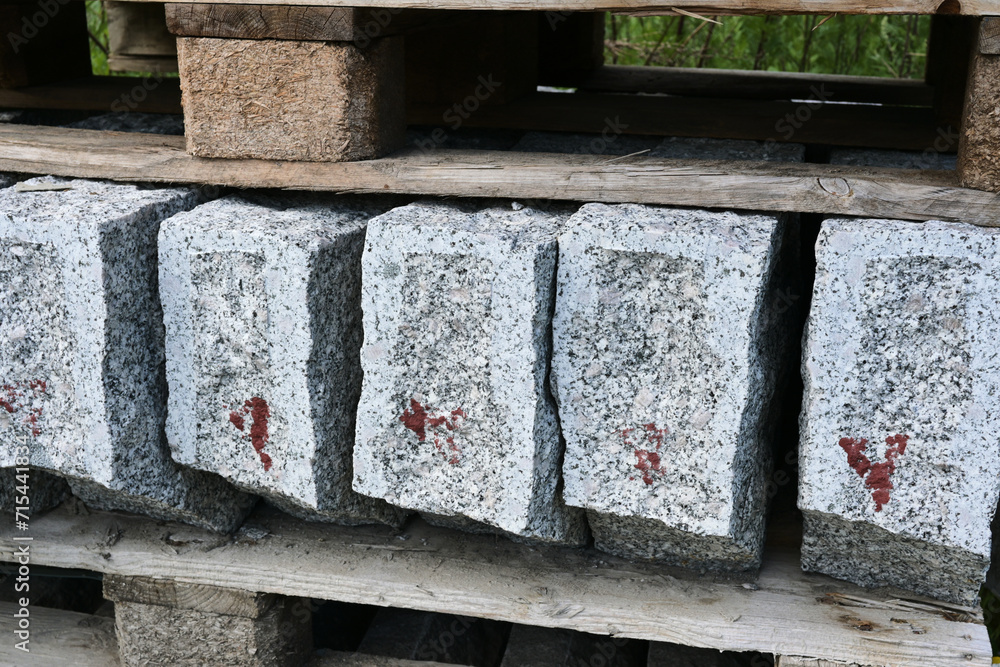 Stone marble building blocks are stored outside