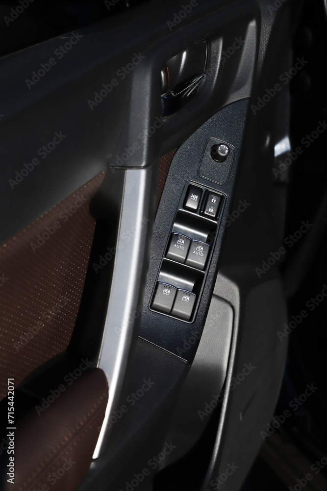 black interior of a modern car. Dashboard. Luxury leather steering wheel. Auto controls. Car doors inside. Car chairs and seats. Car sofa. Back and front row. Interior and door trim. High quality