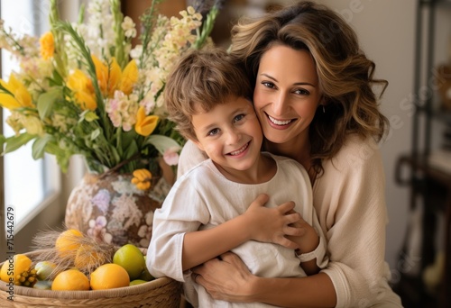 mom holding son in front of easter basket.