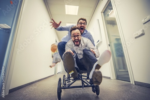 Lighthearted and comical image of two good humoured colleagues getting up to some mischief in the office.  photo