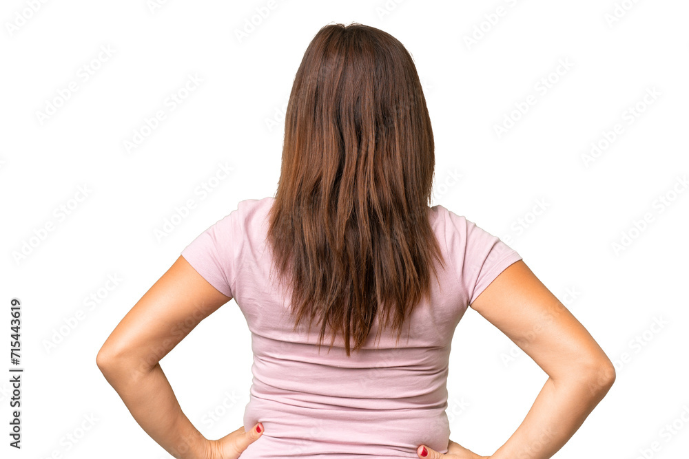 Middle-aged caucasian woman over isolated background in back position Middle-aged caucasian woman over isolated background in back position