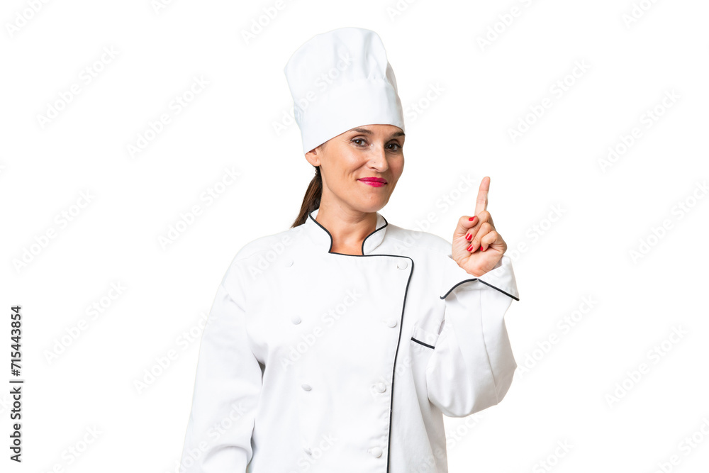 Middle-aged chef woman over isolated background showing and lifting a finger in sign of the best Middle-aged chef woman over isolated background showing and lifting a finger in sign of the best