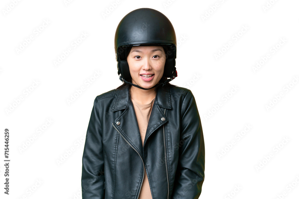 Young Asian woman with a motorcycle helmet over isolated chroma key background with surprise facial expression Young Asian woman with a motorcycle helmet over isolated chroma key background with surprise facial expression