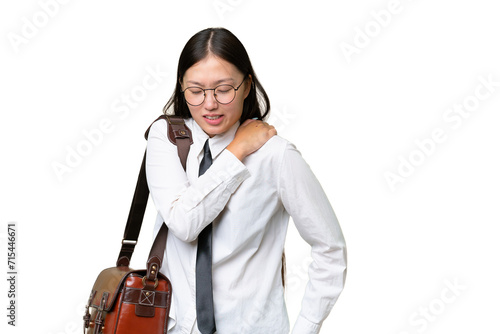 Young Asian business woman over isolated background suffering from pain in shoulder for having made an effort