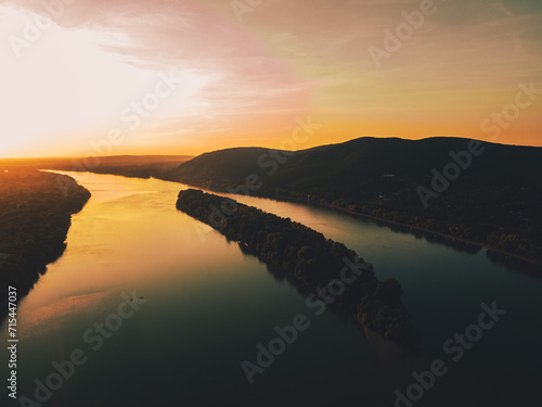 Bilde på lerret Top view of river shore, surrounded by forest with sand coastline, beach