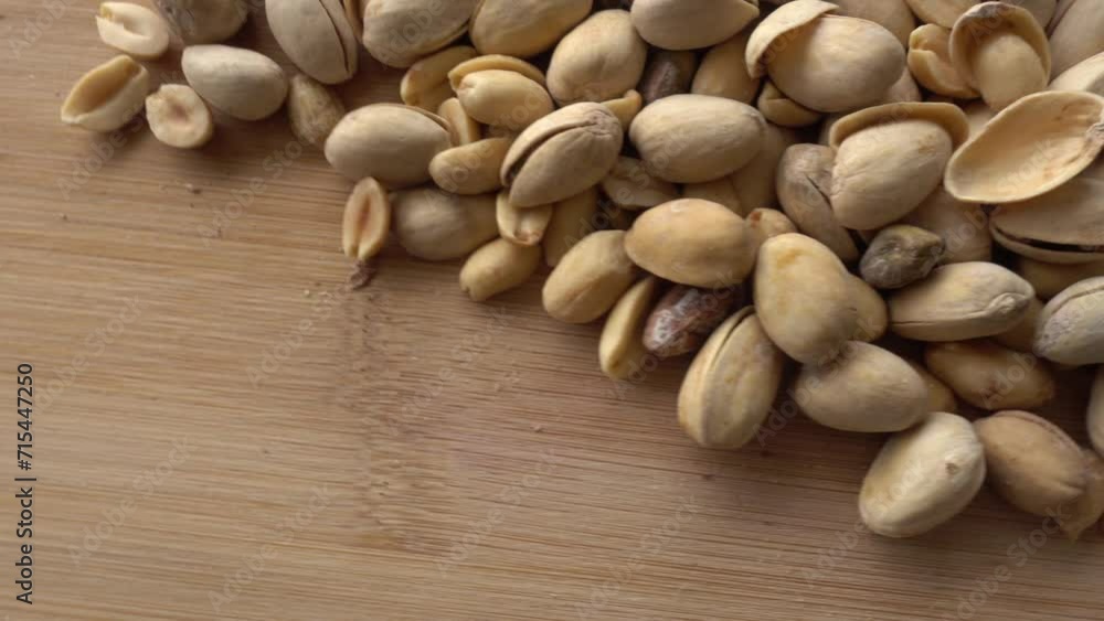 Food background. Roasted pistachio nuts seed with shell close up. Dieting concept Food background. Roasted pistachio nuts seed with shell close up. Dieting concept