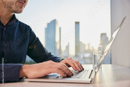 Mature businessman working on laptop photo