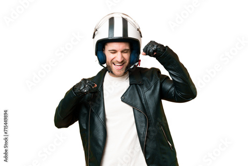 Young handsome blonde man with a motorcycle helmet over isolated chroma key background celebrating a victory