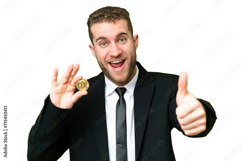Young business blonde man holding a Bitcoin over isolated chroma key background with thumbs up because something good has happened Young business blonde man holding a Bitcoin over isolated chroma key background with thumbs up because something good has happened