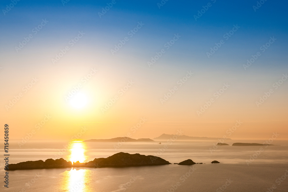 Greece, Ionian Islands, Sun setting over Nisida Kravi island Greece, Ionian Islands, Sun setting over Nisida Kravi island