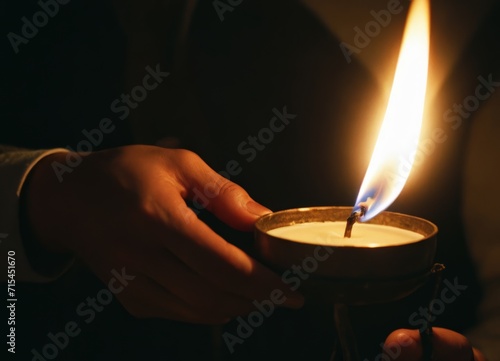 man handling iron firing candle in the hands