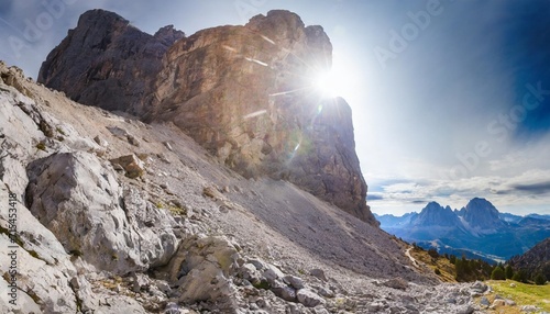 view from below to a giant rock collapsed from the mount where have been found dinosaurs footprints dating back 200 million years ago mount pelmo the dolomites italy photo