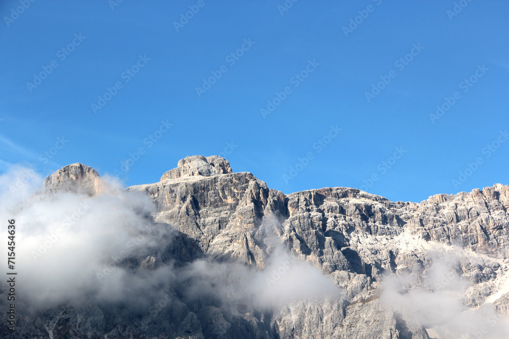Tremendous mountain peak in clouds