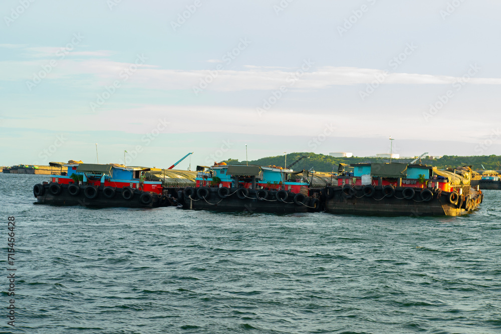 Shipping boat transport on sea bay shipping port city background
