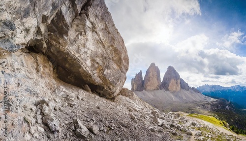 view from below to a giant rock collapsed from the mount where have been found dinosaurs footprints dating back 200 million years ago mount pelmo the dolomites italy photo